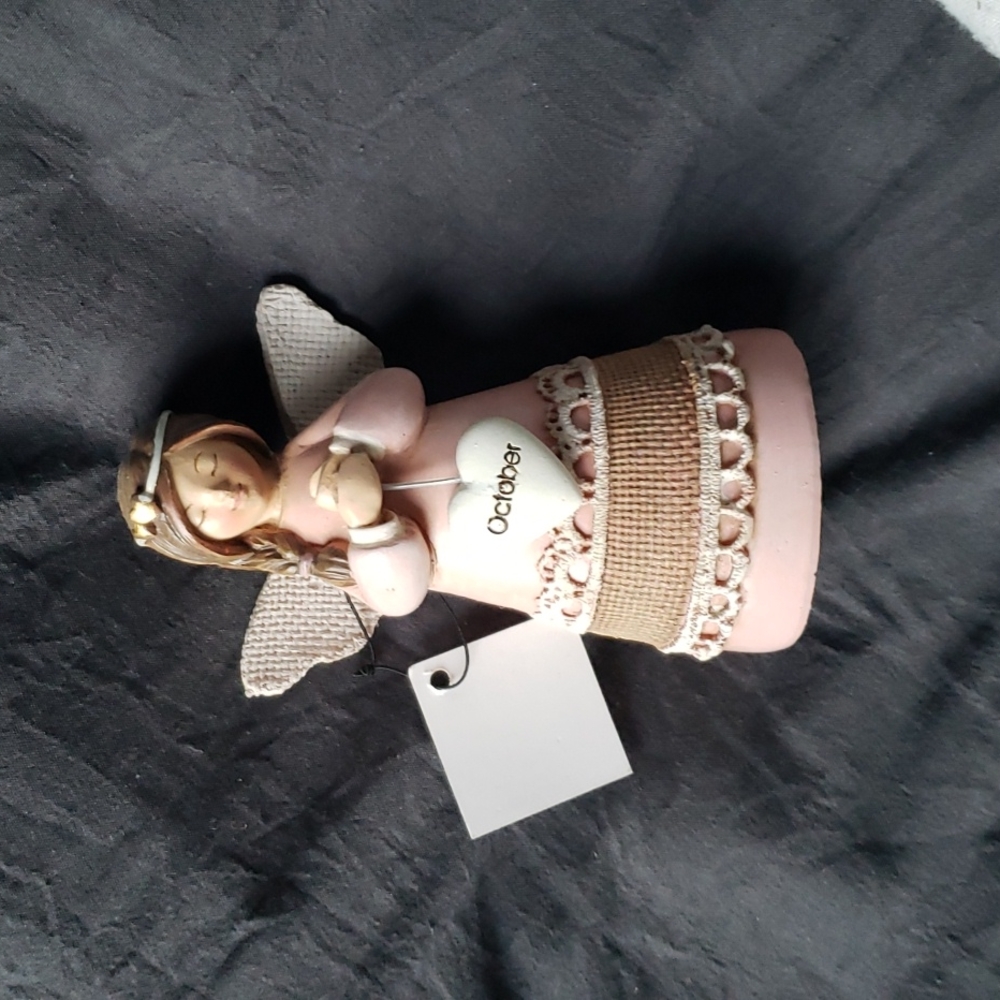 october angel figurine